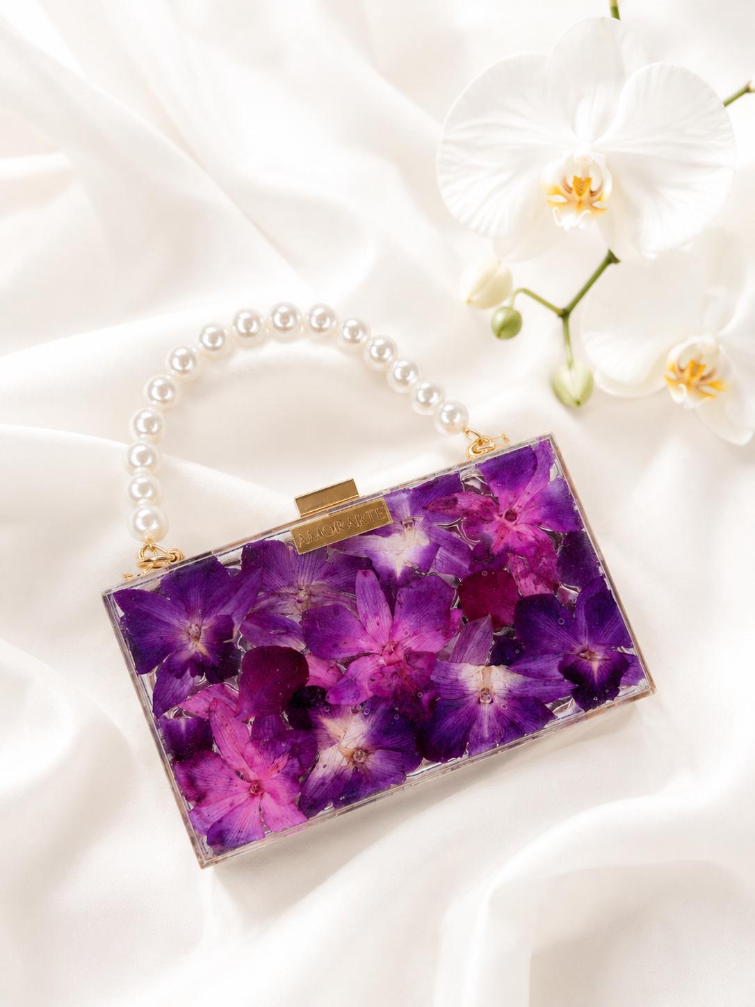 Cartera de orquideas fucsia y morada romanti