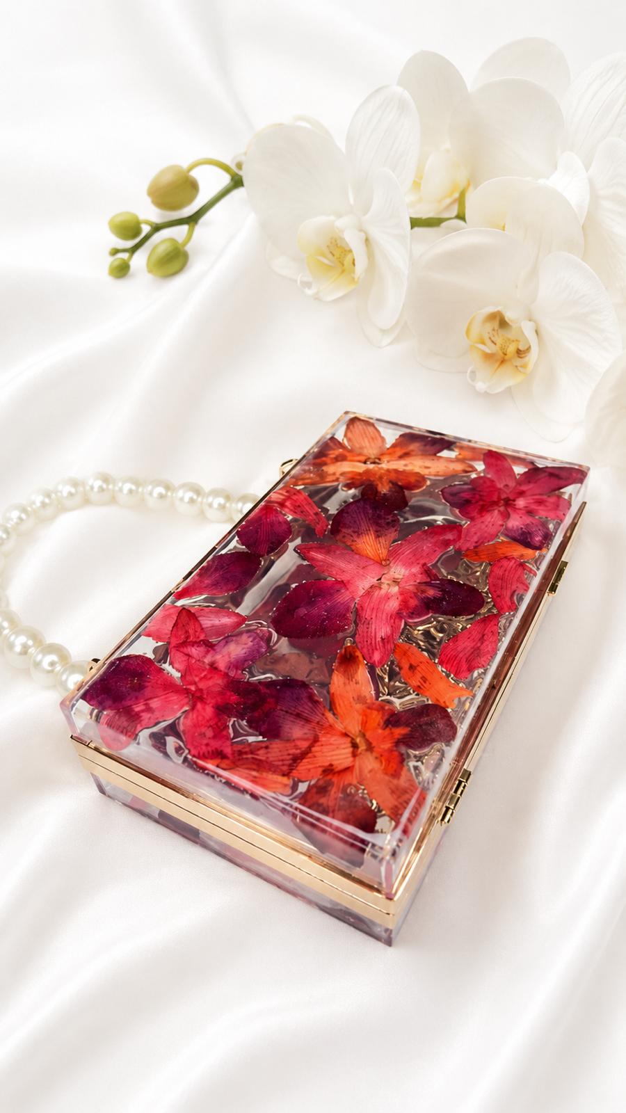 Cartera de orquidea naranja rojo intense
